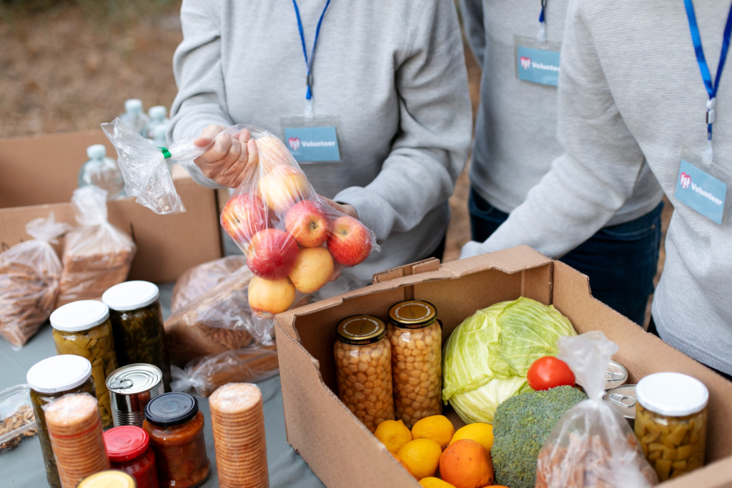 volunteers collecting food donations close up (1)